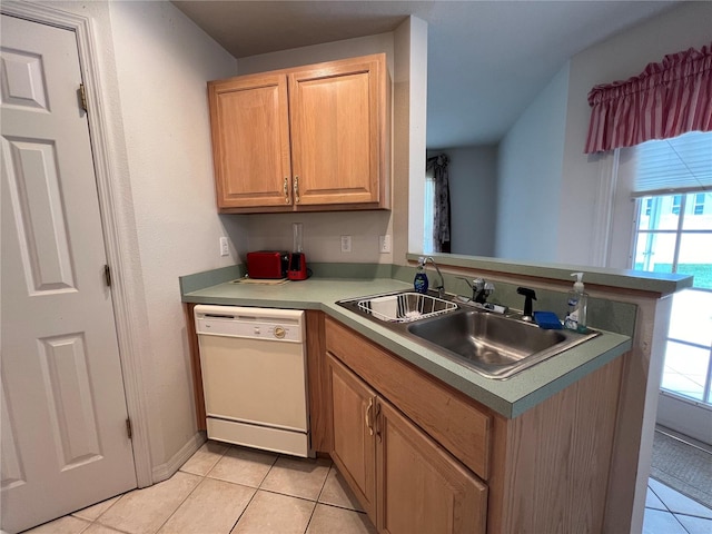 kitchen with kitchen peninsula, light tile floors, dishwasher, and sink