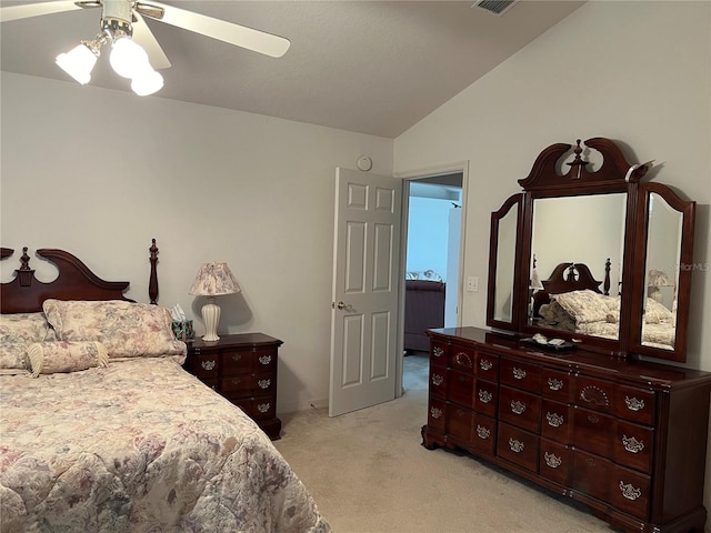 carpeted bedroom with vaulted ceiling and ceiling fan