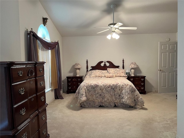 bedroom featuring light carpet and ceiling fan