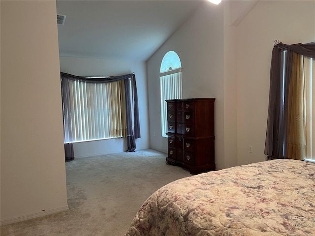 carpeted bedroom featuring vaulted ceiling