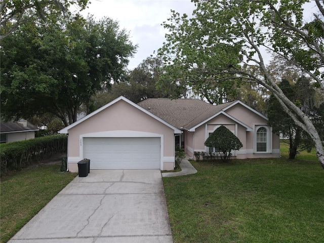 ranch-style home featuring a front yard and a garage