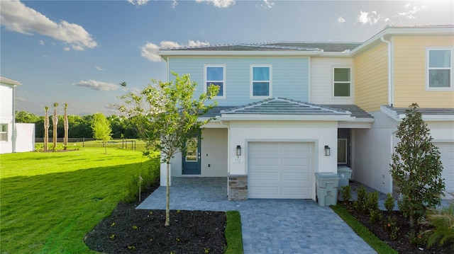 view of front of house with a front lawn and a garage