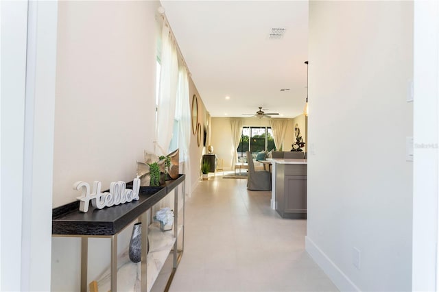 hallway with light tile floors