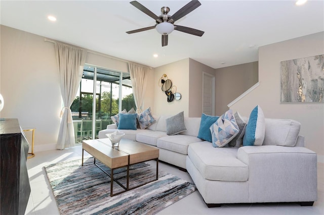 living room featuring ceiling fan and light tile floors