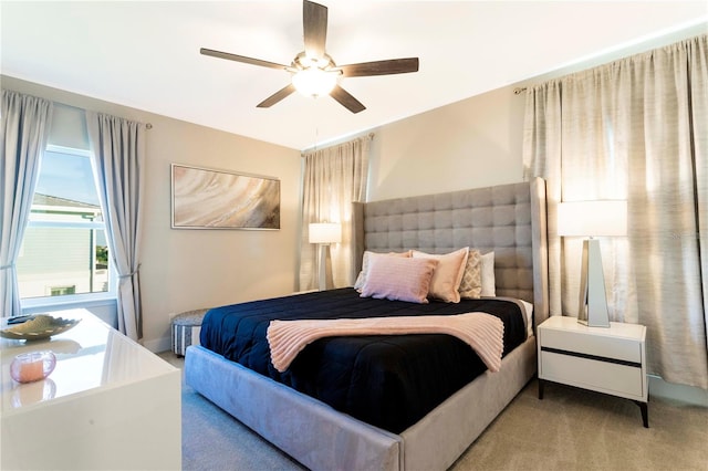 carpeted bedroom featuring ceiling fan