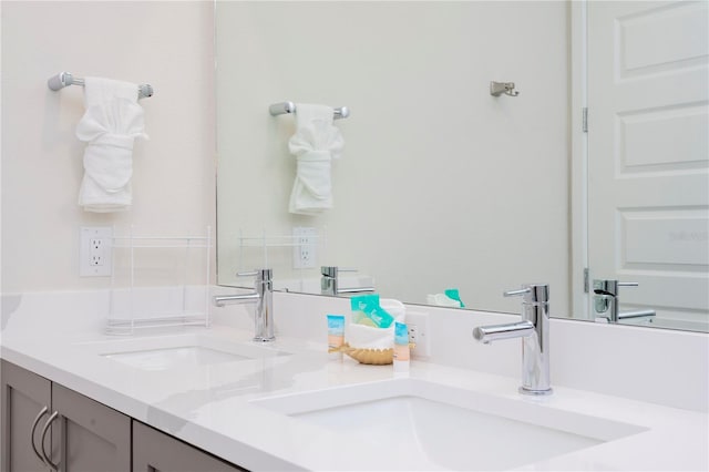 bathroom featuring double vanity