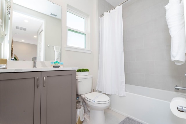 full bathroom with toilet, tile floors, shower / tub combo with curtain, and vanity