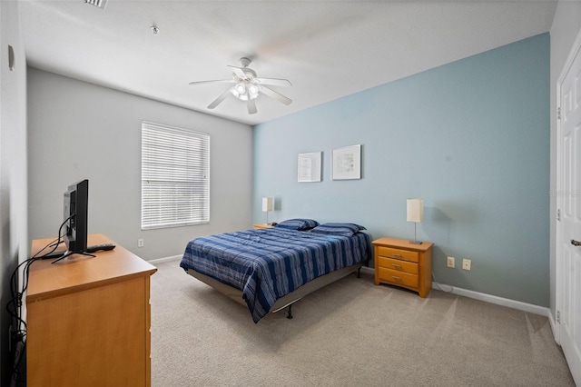 bedroom featuring light carpet and ceiling fan