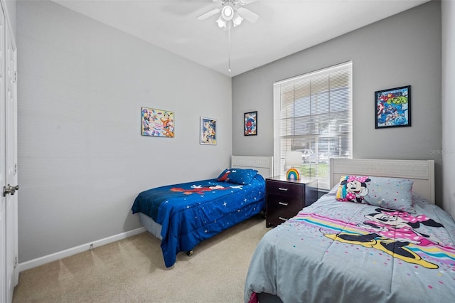 bedroom with light colored carpet and ceiling fan