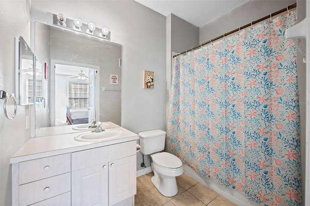 bathroom with toilet, tile flooring, ceiling fan, and oversized vanity