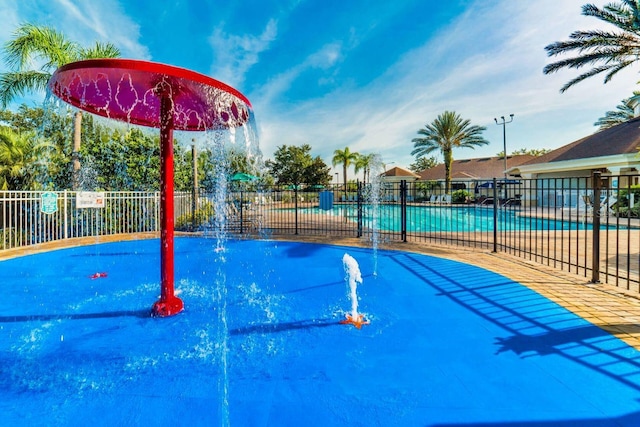 view of home's community with a swimming pool