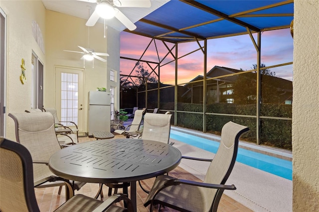 sunroom / solarium with ceiling fan