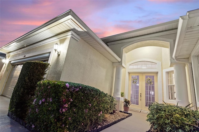 exterior entry at dusk with french doors