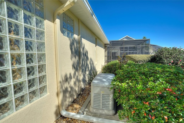 view of home's exterior with a lanai