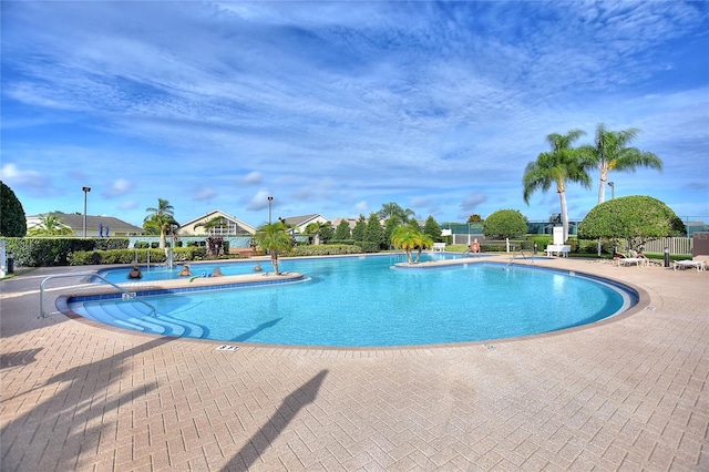 view of swimming pool featuring a patio