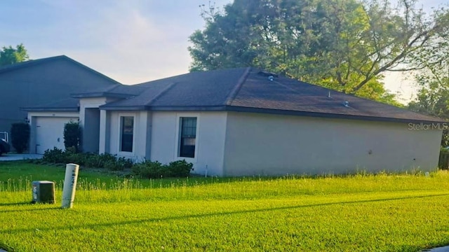 view of property exterior featuring a yard