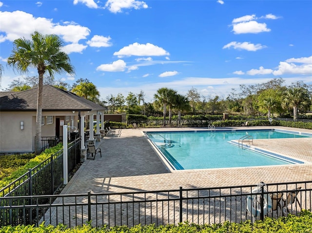 view of swimming pool with a patio area