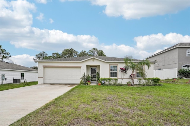 ranch-style home featuring a garage, a front lawn, and central AC