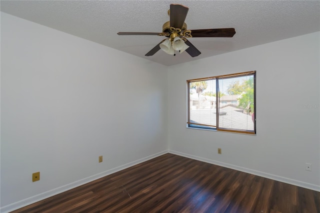 empty room with a textured ceiling, hardwood / wood-style flooring, and ceiling fan