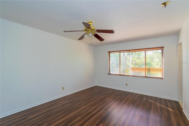 empty room with a textured ceiling, wood-type flooring, and ceiling fan