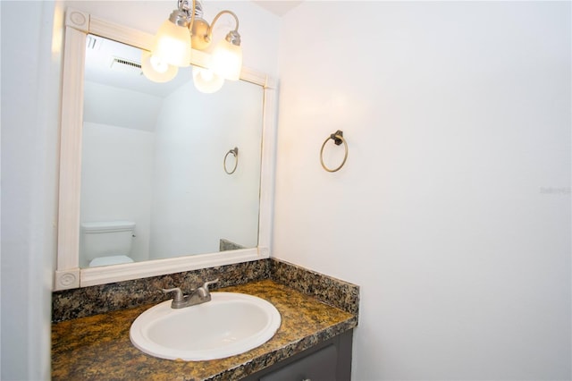 bathroom with vanity and toilet