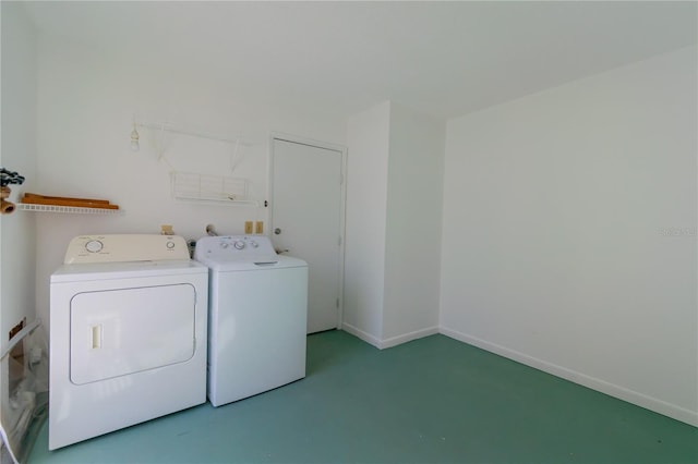 washroom featuring washer and clothes dryer