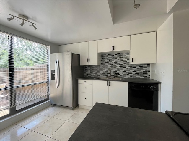 kitchen featuring stainless steel refrigerator with ice dispenser, decorative backsplash, rail lighting, white cabinets, and black dishwasher