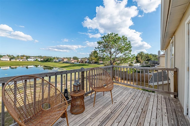 wooden deck with a water view