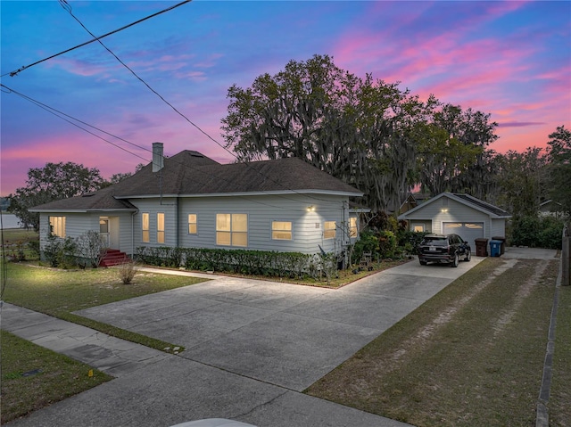 ranch-style house with a lawn and a garage