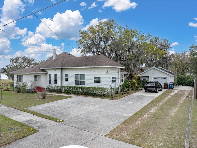 view of front of property with a front yard and a garage