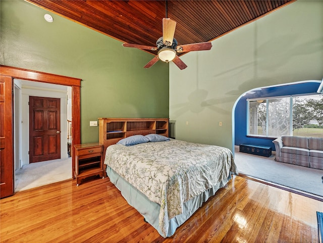 bedroom with wooden ceiling, light hardwood / wood-style floors, and ceiling fan