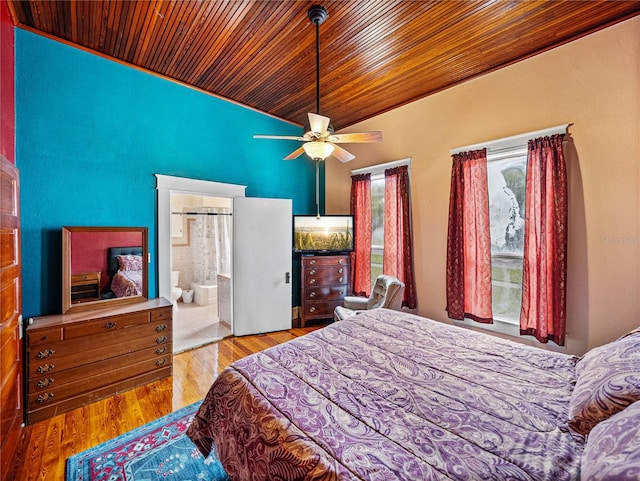 bedroom featuring light hardwood / wood-style flooring, connected bathroom, ceiling fan, and wood ceiling