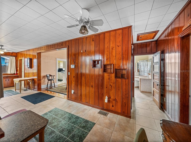 interior space featuring ceiling fan