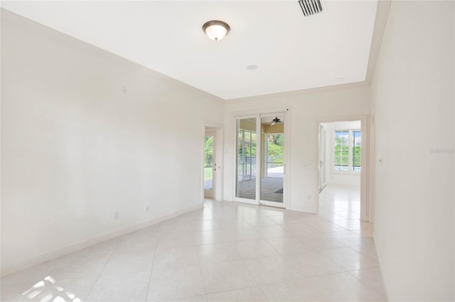 unfurnished room featuring visible vents, crown molding, baseboards, and light tile patterned flooring