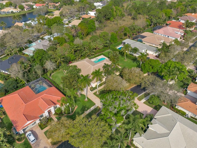 bird's eye view with a residential view and a water view