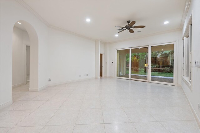 empty room with crown molding, ceiling fan, recessed lighting, arched walkways, and light tile patterned floors
