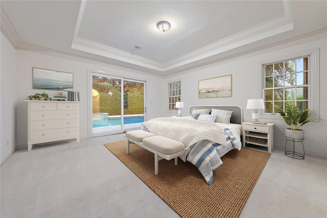 bedroom featuring access to outside, ornamental molding, a tray ceiling, and light colored carpet