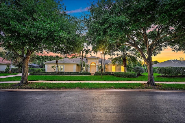 view of front of home with a front lawn