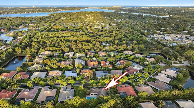 bird's eye view featuring a residential view and a water view