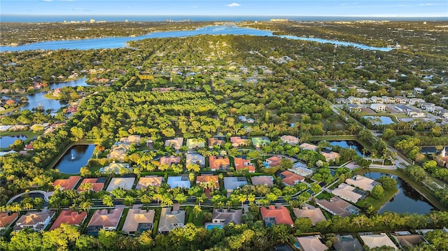 birds eye view of property with a residential view and a water view