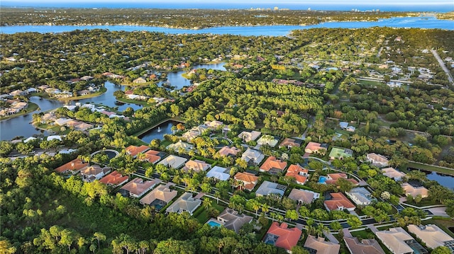 birds eye view of property featuring a water view and a residential view