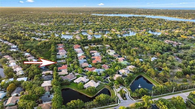 bird's eye view featuring a residential view and a water view