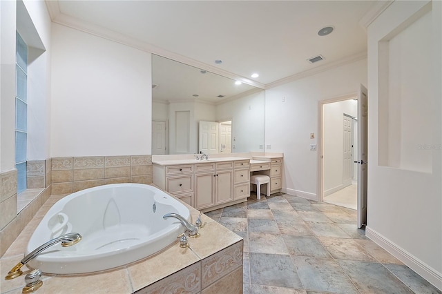 bathroom with crown molding, vanity, baseboards, visible vents, and a garden tub