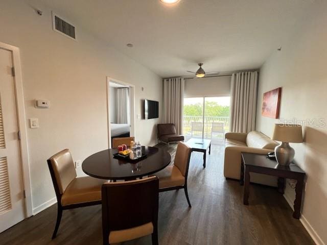 dining area featuring dark hardwood / wood-style floors and ceiling fan