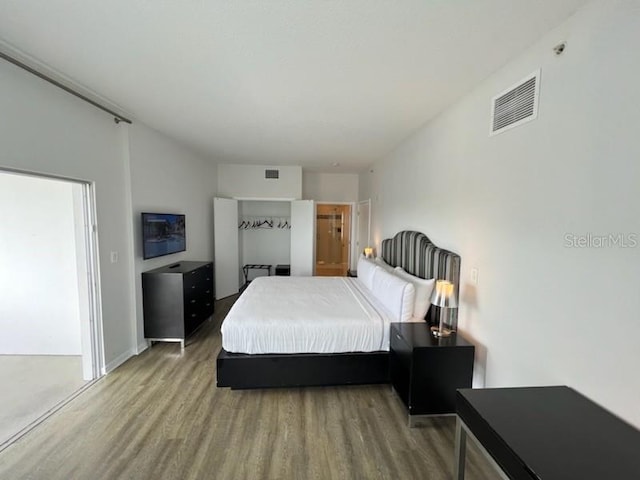 bedroom with light wood-type flooring