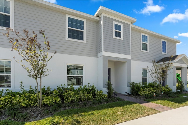 view of front of property with a front lawn