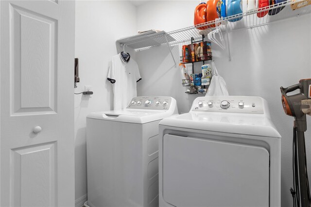 laundry area with separate washer and dryer