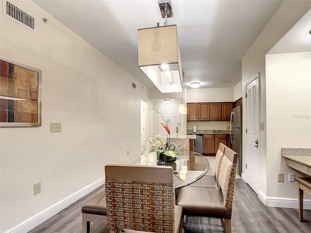 dining area featuring dark hardwood / wood-style flooring