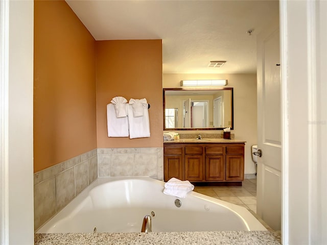 bathroom featuring vanity and tile flooring