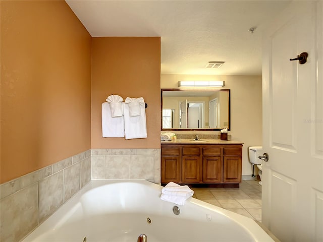 bathroom with tile floors, a textured ceiling, and vanity